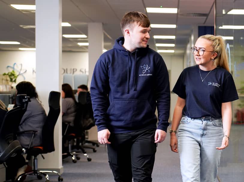 Lisa speaking with a colleague